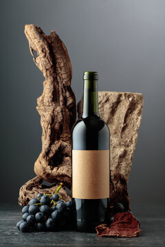 Red wine with stone, dried snags, and blue grapes.