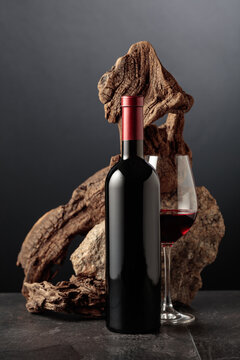 Red wine with old snag and a piece of granite rock.