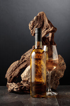 White wine with old snag and a piece of granite rock.