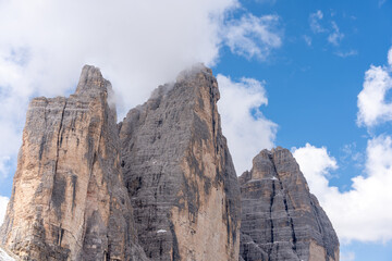 Fototapeta premium Three Peaks of Lavaredo Dolomites clouds covering summit