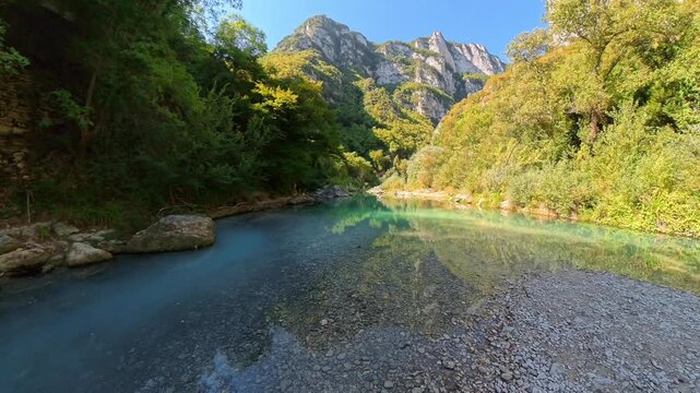 View of Clear Turquoise Sentino River and Rocky Mountain Canyon in Genga Marche Italy