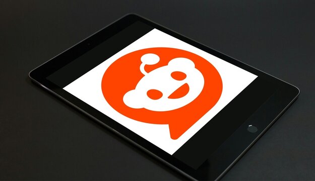 Reddit logo displayed on tablet device representing social media platform and online community.