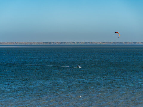 Kitesurfing on calm blue ocean waters in Dakhla Moroccan Sahara