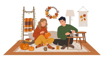 Fototapeta premium Couple carving pumpkins for autumn celebration