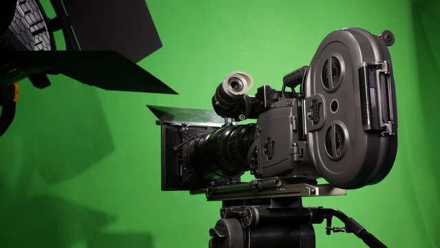 Behind the scenes. BTS of TV commercial movie film or video shooting production which pro camera crew setting up on green screen for chroma key technique in studio. Greenscreen background shooting set