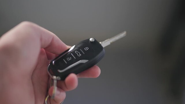 Close-up of a modern car key with metallic details and sleek design