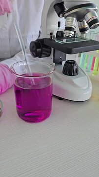 Mixing solutions with a microscope in a laboratory setting