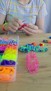 Creating colorful rubber band crafts at home with simple tools and fun designs