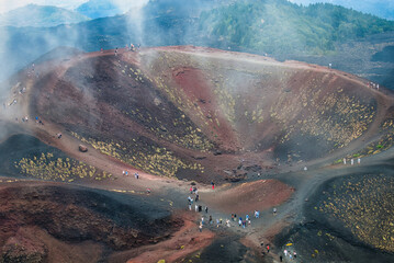 Aerial view of Crateri Silvestri volcanic craters on Mount Etna with hikers walking the trails, Sicily, Italy © Filippo Labate