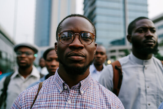 Determined African American Men Standing Together in City