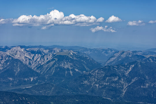 Layered Alpine Mountain Ranges and Paraglider Viewed from Zugspitze Summit