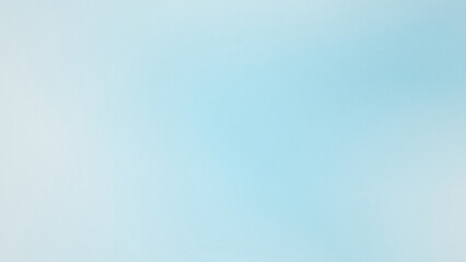 Naklejka premium Soft blue gradient background with subtle light bokeh for digital design and advertising