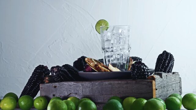 Pouring Peruvian Chicha Morada Purple Corn Drink with Lime and Cinnamon