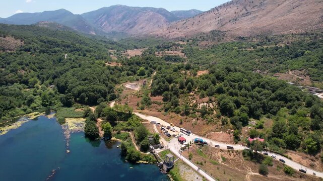 Dam of Bistrica near Blue Eye Albania. Aerial rising over Blue eye spring a natural phenomenon in Albania. Aerial panoramic drone view from above, top view from drone.   
