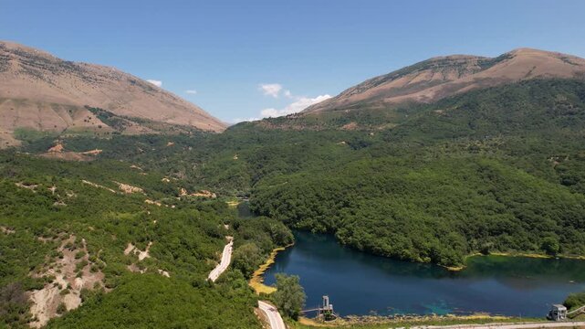 Dam of Bistrica near Blue Eye Albania. Aerial rising over Blue eye spring a natural phenomenon in Albania. Aerial panoramic drone view from above, top view from drone.   
