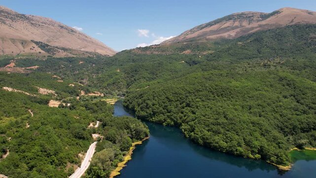 Dam of Bistrica near Blue Eye Albania. Aerial rising over Blue eye spring a natural phenomenon in Albania. Aerial panoramic drone view from above, top view from drone.   
