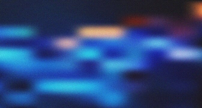 Dynamic blue and orange light streaks forming a vibrant blurred abstract texture with a modern feel