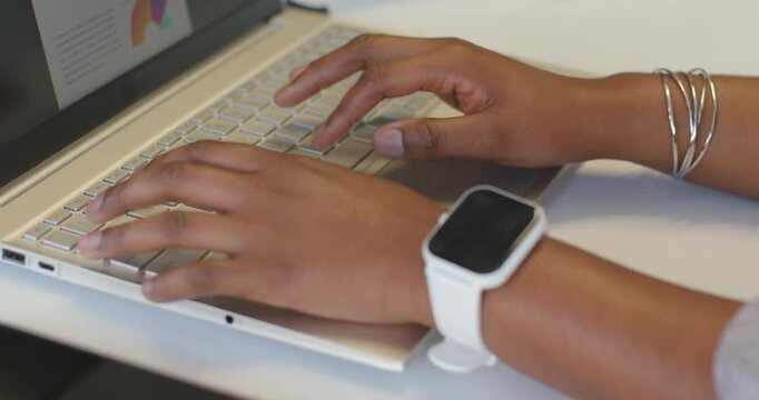 Hands are typing after resting on keyboard, hovering and editing slide content related to chart