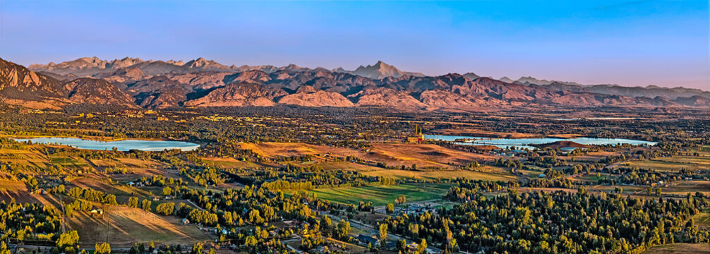 Panorama view of Boulder Colorado with mountain ranges and reservoirs