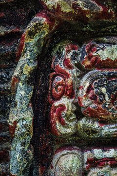 Ancient Mayan polychrome relief sculpture detail with original paint at Copan Ruins