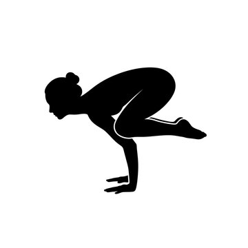 Woman in crow pose silhouette against a white background