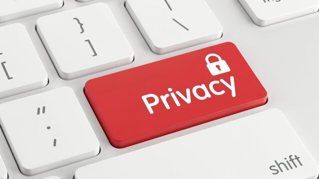 A red enter key with a lock icon and privacy text on a white computer keyboard. Useful for cybersecurity and data protection concepts.
