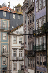 Obraz premium Traditional Portuguese Architecture with Tiled Facades and Balconies