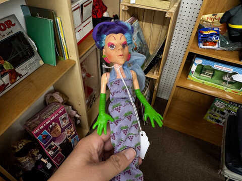 Mesa, Arizona - August 3, 2026: Sour Grapes, the evil grape lady Strawberry Shortcake doll, vintage from the 1980s