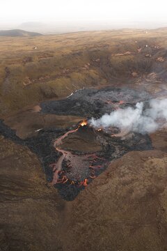 Aerial view from helicopter, erupting volcano, crater with erupting lava and lava flow, Fagradalsfjall, Reykjanes Peninsula, Iceland