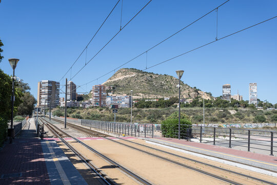 Modern Tram Station Platform with Mountain View in Spanish City