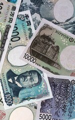 Japanese yen money bills in pile. Big amount of Japan JPY currency cash close up © Viktor