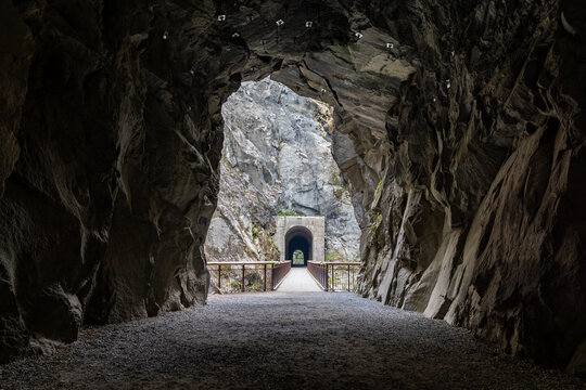 View Through Rocky Tunnel to Bridge and Trail at Othello Tunnels in Hope, BC, Canada