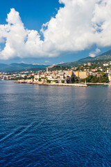 Fototapeta premium The old port of Bastia and the citadel seen from the sea, Haute Corse, Corsican island, France. Leaving Corsica by ferry from Bastia.