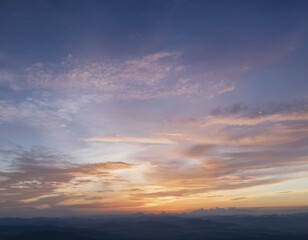 Fototapeta premium A calm and tranquil view of a colorful sunset sky with shades of pink, orange, and blue, enhanced by soft, scattered clouds creating an enchanting atmosphere for relaxation and contemplation, AI generated