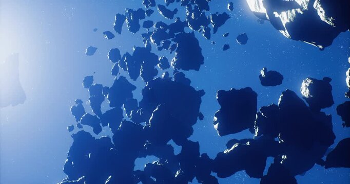 A cluster of asteroids floats in the vastness of space, bathed in sunlight from afar. The scene captures the depth and texture of these rocky formations in a cosmic setting.