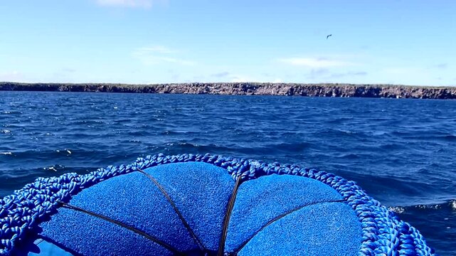 Front of motorized raft speeding though ocean waves passenger view action video