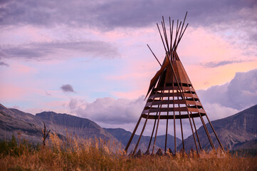 Traditional Teepee Frame Silhouetted at Sunset, Glacier National Park, Montana © davidmarx