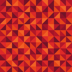 Fototapeta premium Seamless geometric triangle pattern in shades of red and orange creates a modern abstract mosaic design for textile and digital projects