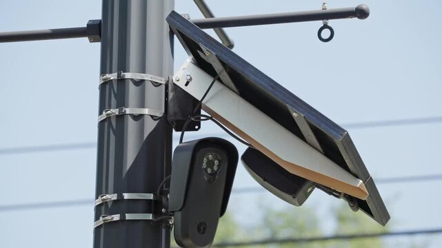 ALPR camera FLOCK safety surveillance for high-speed, computer-controlled systems and automatic license plate recognition on road pole mount to detect car speed in slow motion powered by solar panel