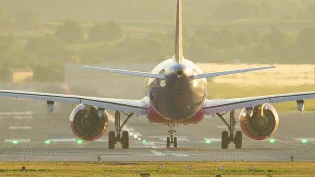 Commercial airplane accelerating and taking off from the runway