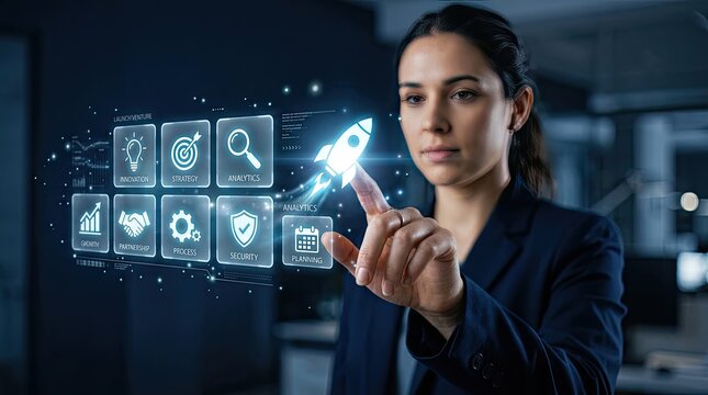 Professional businesswoman interacting with a futuristic digital holographic interface showing various business startup and technology icons in office