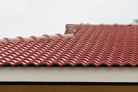Red ceramic roof tiles on a traditional building