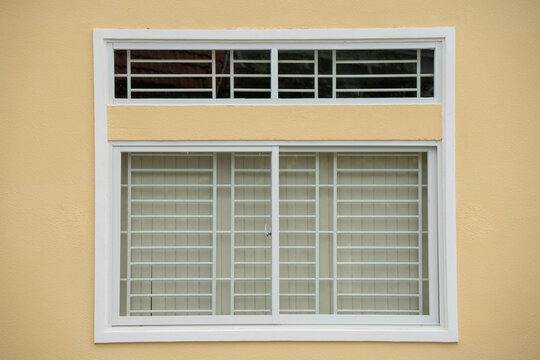 Traditional building facade with large windows and shutters
