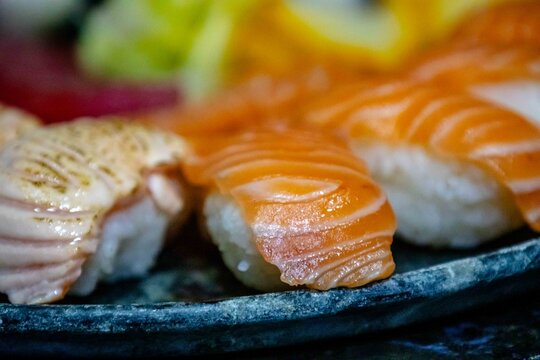 Assorted Nigiri Sushi Platter on Dark Textured Plate