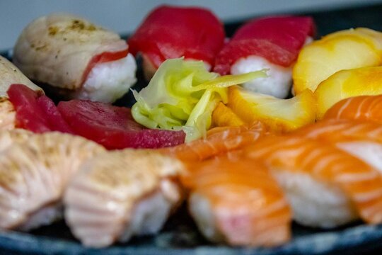 Assorted Nigiri Sushi Platter on Dark Textured Plate