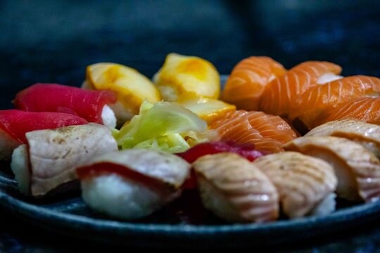 Assorted Nigiri Sushi Platter on Dark Textured Plate