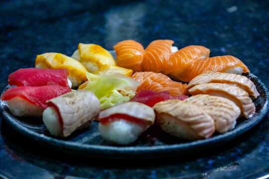 Assorted Nigiri Sushi Platter on Dark Textured Plate
