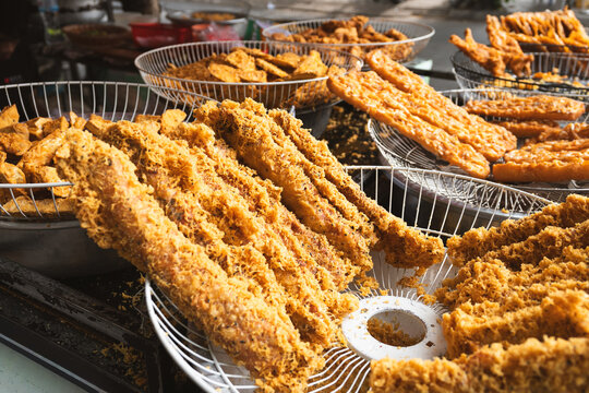 Crispy fried food skewers at a local street food market