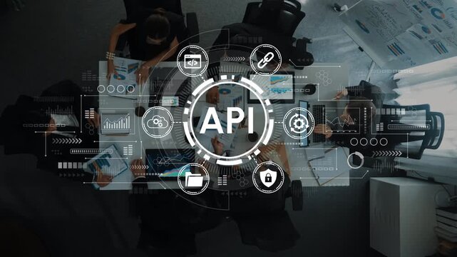 Professional meeting with diverse team brainstorming digital strategies including API development concept depicted with overlays of visuals and data elements. Entropy.