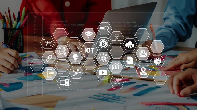 A modern office setting showcasing teamwork and innovation. Multiple hands engage with technology icons while discussing business solutions and strategies. Raster